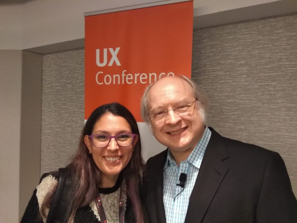 Joi Arnaiz with Jakob Nielsen at a UX conference